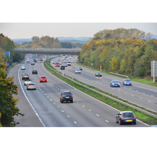 Cars driving along a scenic road